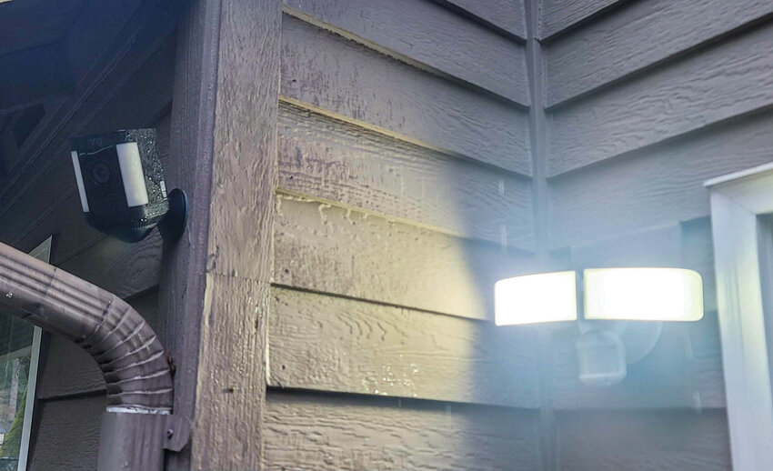 A home with motion-activated RING lights and a security camera demonstrates the effectiveness of visible deterrents against potential intruders. La Center Police Chief Phil Sample highlighted the importance of robust security systems, including outdoor lighting, motion sensors and cameras, in preventing home break-ins.