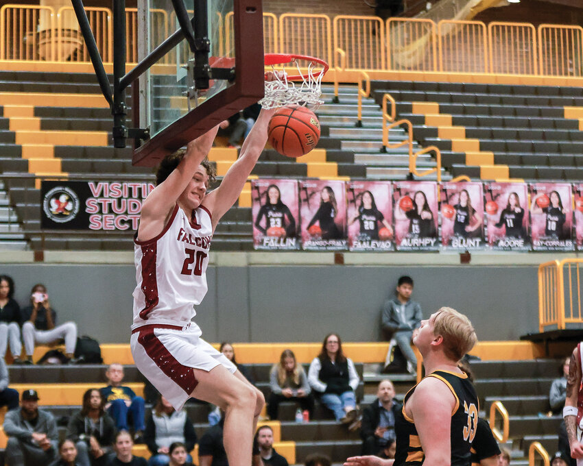 Prairie&rsquo;s Carson Morningstar slams it home early in the Falcons&rsquo; 79-36 win over Hudson&rsquo;s Bay High School on Friday, Jan. 3.