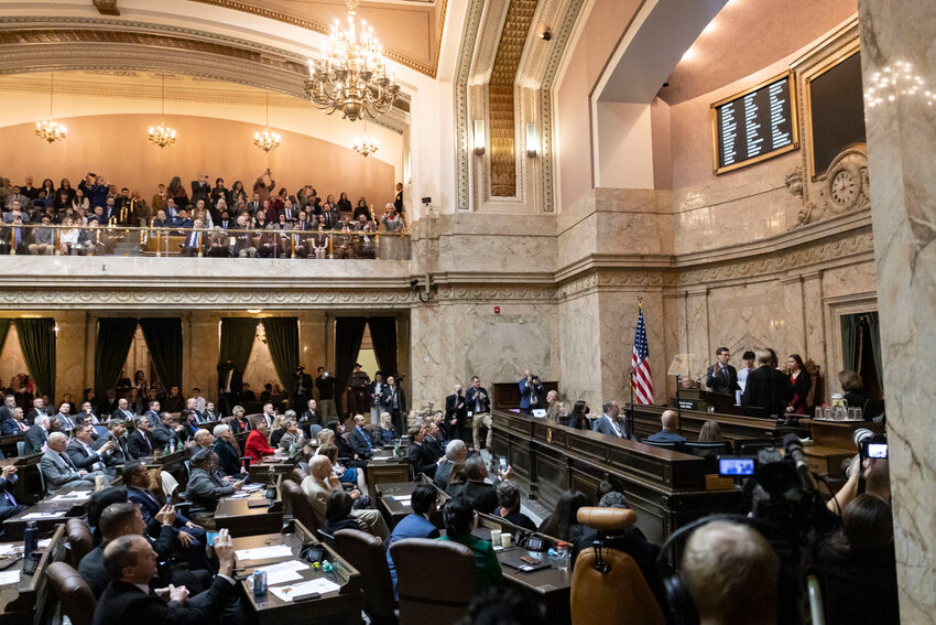 Washington Gov. Bob Ferguson is sworn into office by Supreme Court chief justice Debra L. Stephens during a joint legislative session in the House chambers at the Washington State Capitol in Olympia on Wednesday, Jan. 15.