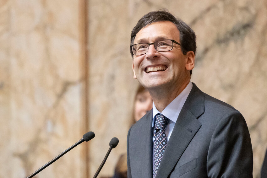 Gov. Bob Ferguson smiles at his family during his inaugural address at the Washington State Capitol in Olympia on Wednesday, Jan. 15.