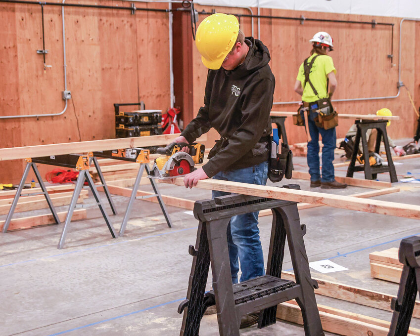 Hockinson High School CTE student Lars Sarkinen makes a cut on a board during a SkillsUSA carpentry competition in Ridgefield on Friday, Jan. 17.