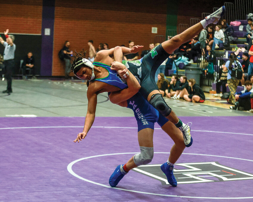 La Center&rsquo;s 165-pound wrestler Isaac Chromey throws Mountain View&rsquo;s Kingston McPherson in the title match of the Norm Friehauf Clark County Championships on Saturday, Jan. 18.