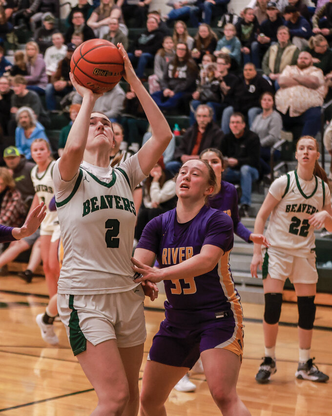 Woodland sophomore forward Kennedy Bockert goes for a contested bucket in the paint during the Beavers&rsquo; 42-41 loss to league-leading Columbia River Rapids on Tuesday, Jan. 14.
