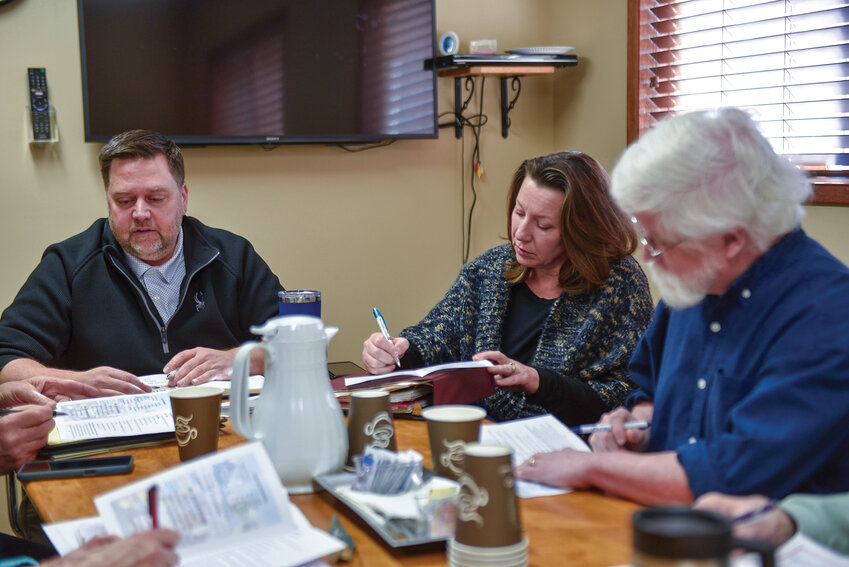 Kiwanis Club of Ridgefield/La Center President Jason Hair (left) discusses final details for the upcoming charter night celebration during a recent meeting. The event, set for 5:30 p.m. to 8 p.m. Friday, Jan. 31, at La Center Church, 111 E. Fifth St., will include a Greek-themed dinner and fundraising activities. Ridgefield and La Center community members are invited to celebrate the new local chapter's official formation.