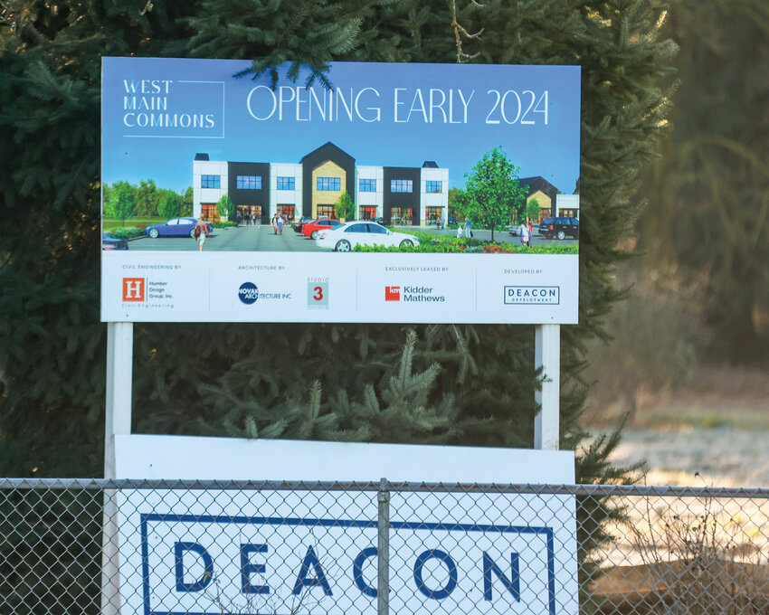A sign in a vacant property adjacent to the lone hotel in Battle Ground states that the West Main Commons project will open in early 2024, but as of early 2025, no work has begun.