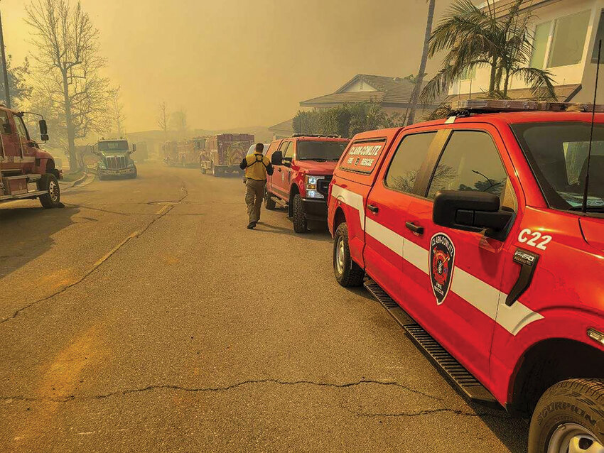 A Clark-Cowlitz Fire Rescue pickup truck is seen parked in a neighborhood filled with smoke from the Palisades fire in Los Angeles County, California.