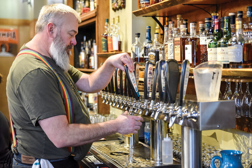 Staff member Jarod Kaye pours a glass of Sneaky Sneaky Oatmeal Stout at Everybody&rsquo;s at Northwood, where 17 of the brewery's beers are now available on tap. The pub will host a grand opening celebration, featuring live music, family-friendly activities and craft beer, from 11:30 a.m. to 11:30 p.m. Saturday, Feb. 8, at 1401 SE Rasmussen Blvd.
