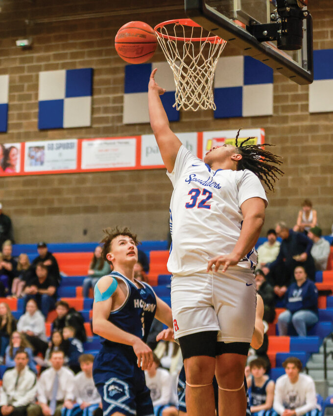 Ridgefield senior forward Isaiah Ashenfelter puts down a reverse layup during the Spudders&rsquo; 84-52 win over the Hockinson Hawks on Wednesday, Jan. 29.