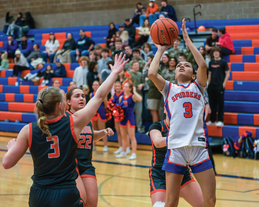 Ridgefield junior guard Sava Chanda makes a close basket during the fourth quarter of the Spudders&rsquo; 50-41 win over the Washougal Panthers on Thursday, Jan. 30.