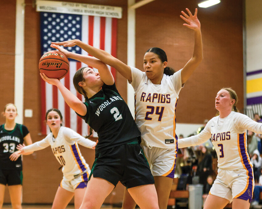 Woodland sophomore forward Kennedy Bockert is fouled by Columbia River&rsquo;s Avi Desjarlais during the Beavers&rsquo; 50-42 loss to the Rapids on Thursday, Feb. 6.
