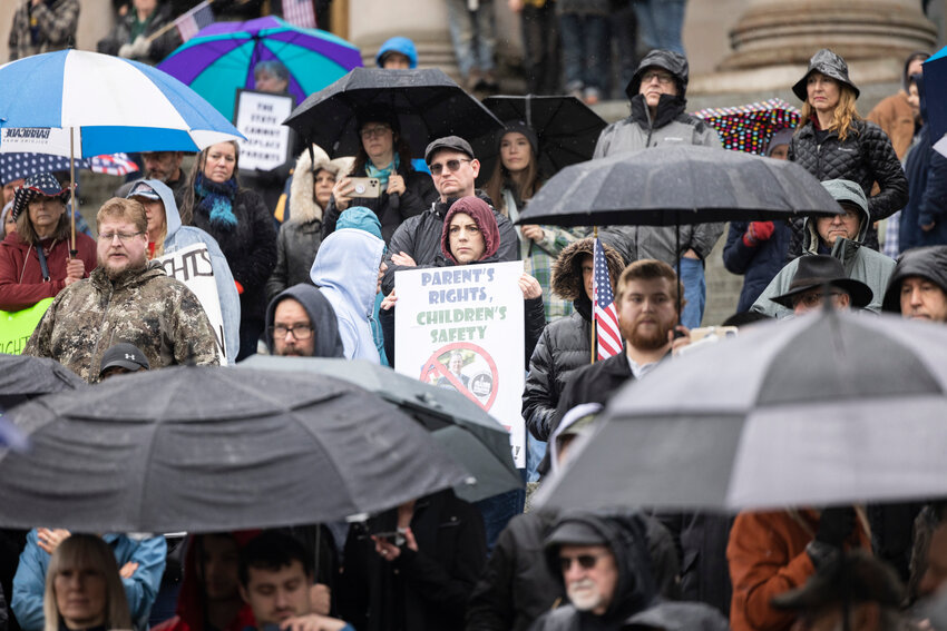 Rally participants stand on the Capitol steps in support of parents&rsquo; rights at a rally organized by Let&rsquo;s Go Washington in Olympia on Saturday, Feb. 15.