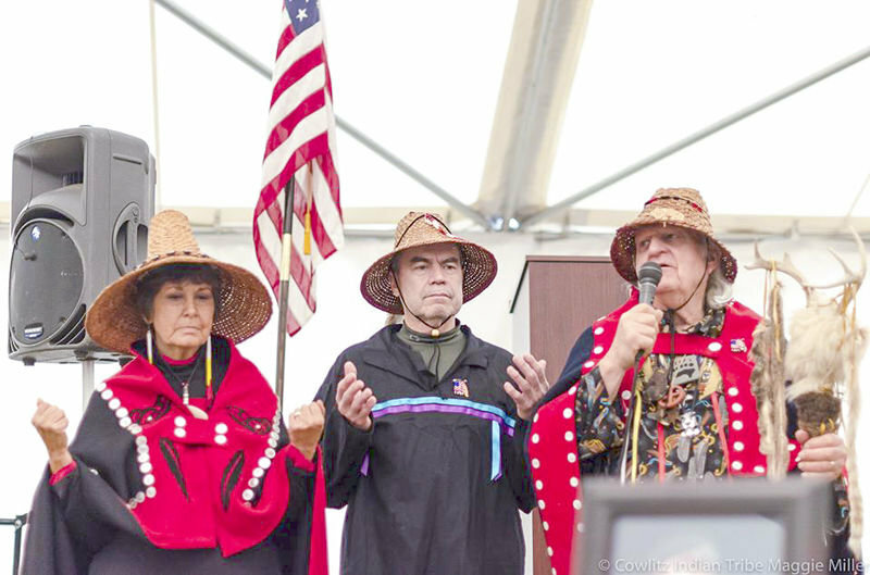 FILE PHOTO &mdash; Cowlitz Indian Tribe chairman Bill Iyall, center, stands with two of his tribe&rsquo;s spiritual leaders, Tanna Engdahl, left, and Roy Wilson, right, at a gathering on the tribe&rsquo;s new reservation land near La Center in late December 2014.