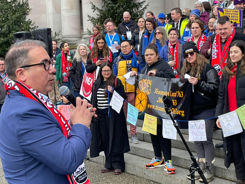 Washington state Sen. Adrian Cortes speaks to hundreds of teachers, school employees and students on Feb. 17, 2025 at the Washington state Capitol. Following the rally, attendees met with lawmakers to urge them to increase funding for public schools. (Jerry Cornfield/Washington State Standard)