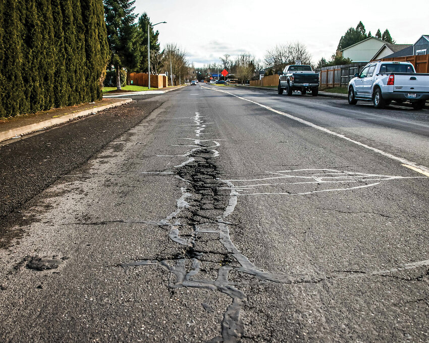 A pothole on Northwest 15th Avenue is among several in need of repair as part of Battle Ground&rsquo;s ongoing street preservation efforts.