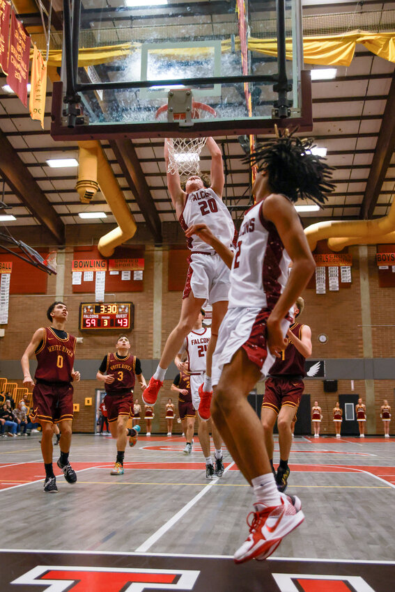 Prairie&rsquo;s Carson Morningstar slams it home after a lob off the blackboard by Jamir Jones during the team&rsquo;s 88-73 win over White River High School on Tuesday, Feb. 18.