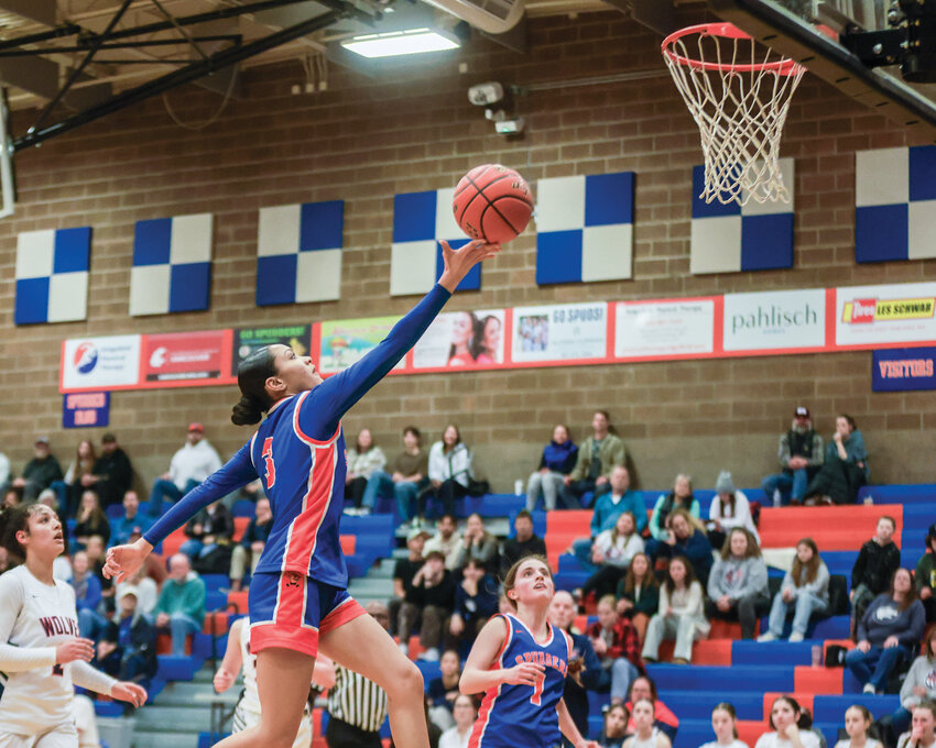Ridgefield&rsquo;s Sava Chanda stretches for a layup in the Spudders&rsquo; state clinching 57-37 win over Black Hills High School on Wednesday, Feb. 19.