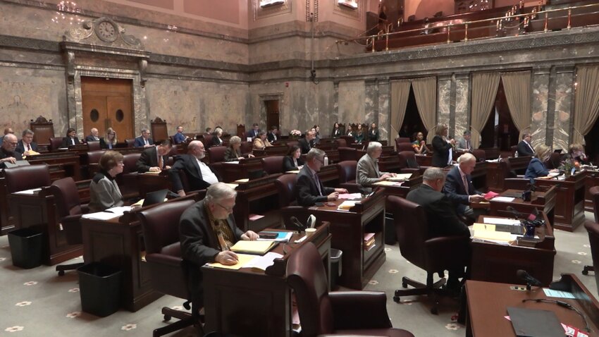 Lawmakers on the floor of the Washington state Senate in Olympia. (Photo by Albert James)