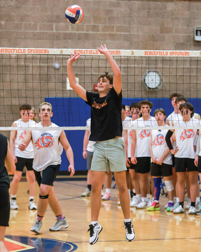 Battle Ground&rsquo;s Jayden Lapatskay sets the ball during the charity fundraiser Studball Volleyball Tournament at Ridgefield High School on Friday, March 7.