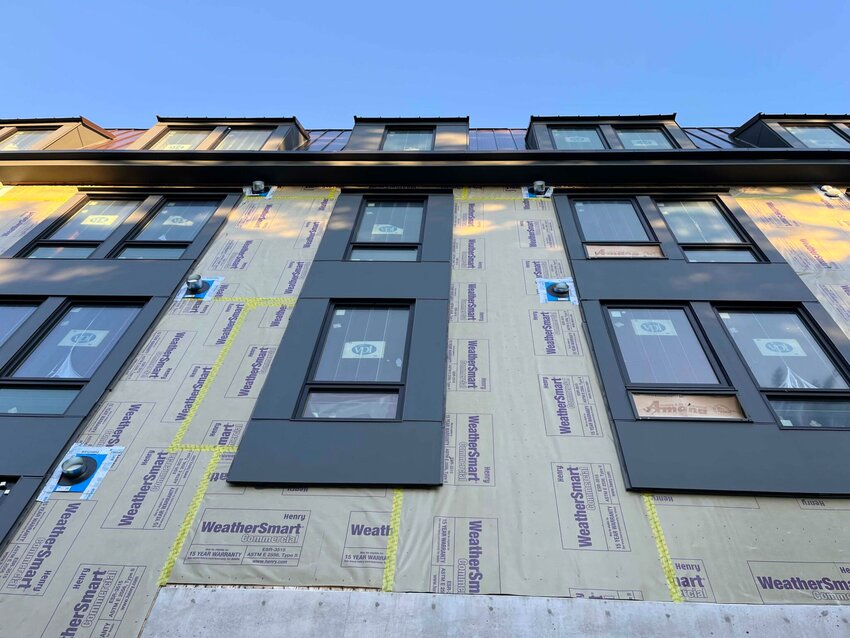 An apartment building under construction in Olympia, Washington in January 2025. Critics of a proposal to cap rent increases in Washington argue that it could stifle new development. (Photo by Bill Lucia/Washington State Standard)
