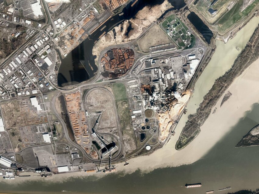 Tan sediment is seen running out of the mouth of the Cowlitz River into the Columbia in 2014.