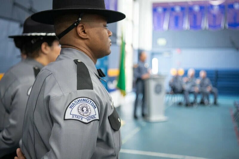 A Washington State Patrol trooper attends the 19th CVEO Basic Open House on Feb. 7, 2024.
