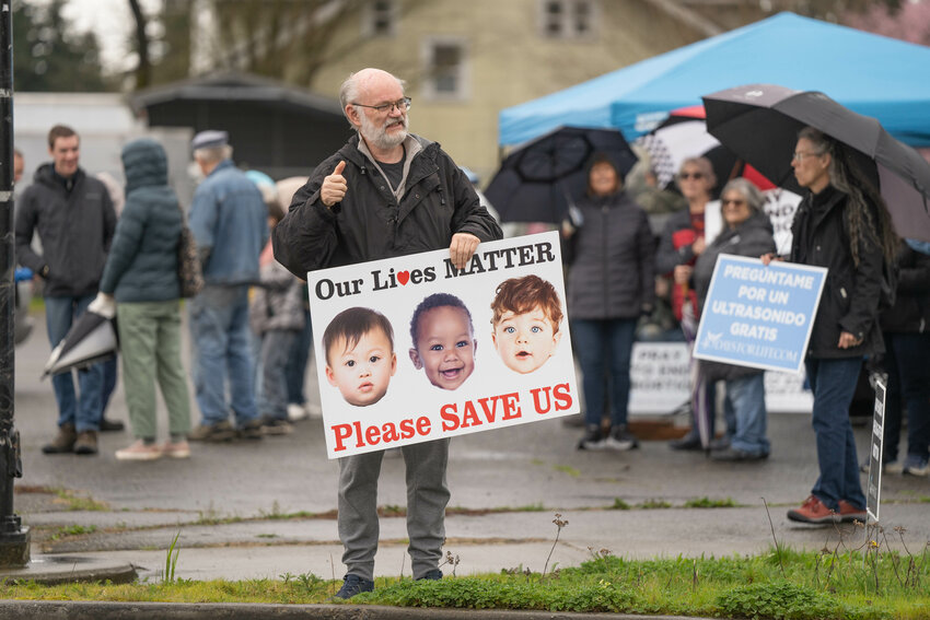 A protester gives a thumbs up during a &ldquo;Pray to End Abortion&rdquo; event organized by 40 Days for Life across the street from Planned Parenthood in Centralia on Monday, March 24, 2025.