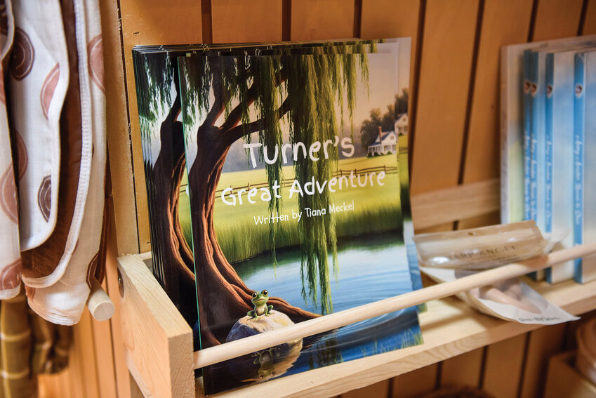 "Turner's Great Adventure" sits alongside other local reads on a Battle Ground bookstore's shelf. The book, written by Tiana Meckel, tells the story of a frog's journey to appreciate the beauty of home.