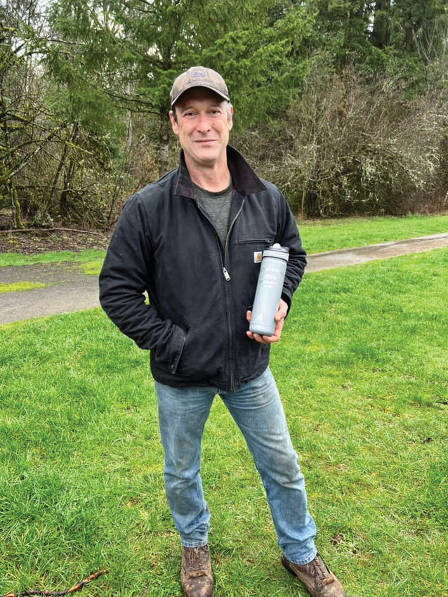 courtesy photo  Battle Ground local Tyler Castle received the 2024 Battle Ground Citizen of the Year Award during his monthly cleanup along Whipple Creek.