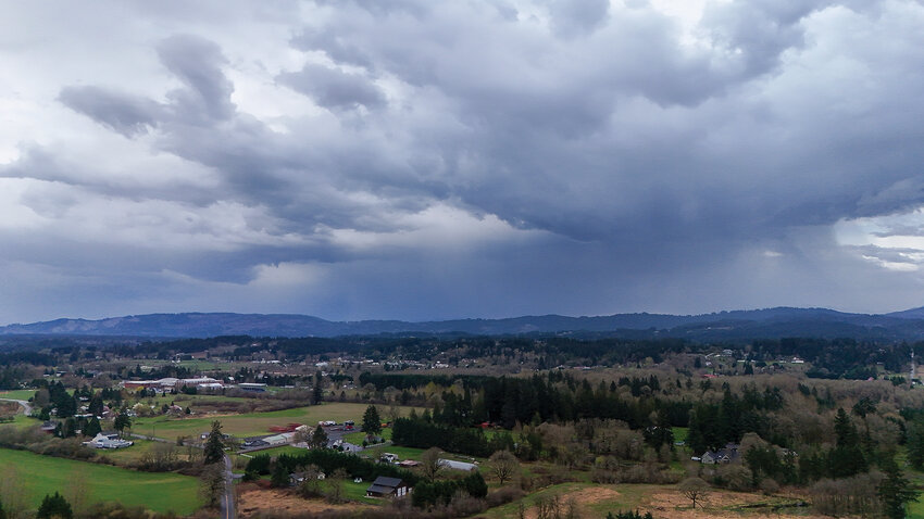 A light thunderstorm rumbles over the Cascade foothills in Clark County on Wednesday, March 26.