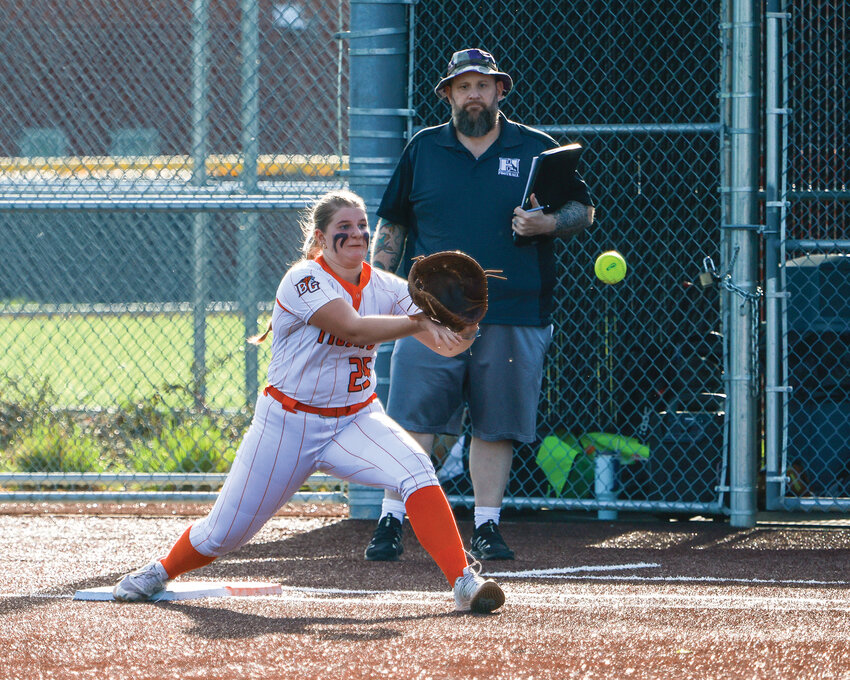 Battle Ground first baseman Delyla Gruenberg catches the ball to secure an out in the Tigers&rsquo; 5-4 loss to Heritage High School on Tuesday, March 25.