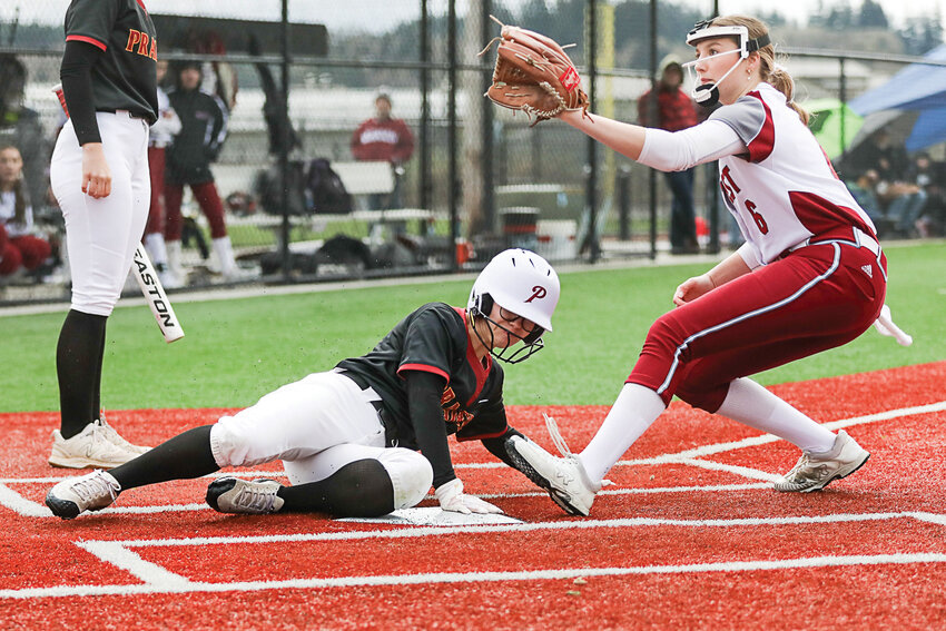 Prairie's Kayla Scholl slides in ahead of the throw to score on a wild pitch during Prairie's win at W.F. West on March 27.