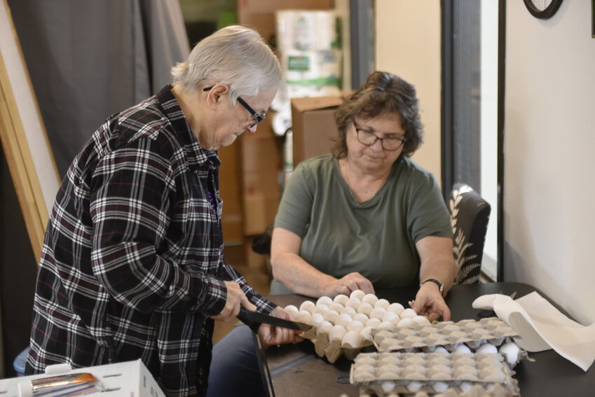 Volunteers sort and prepare eggs donated by Costco for the weekly food distribution. Compassion 360 serves Ridgefield families facing food insecurity, ensuring they have access to fresh and essential groceries.