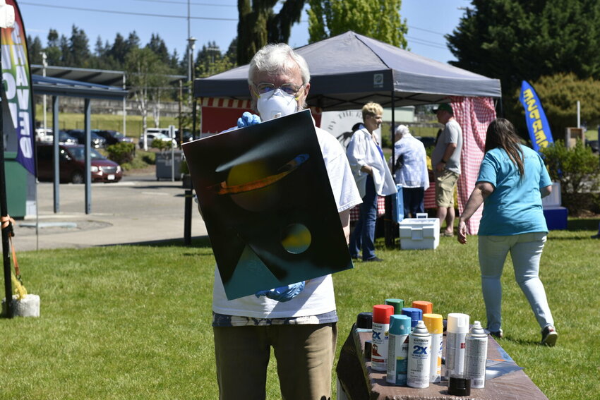 Danny Masterson, a member of the La Center Arts Board, shows off his street art skills during last year&rsquo;s Center Arts Fair. He hosted a spray-painting workshop for attendees. The second annual event returns from 9 a.m. to 4 p.m. Saturday, May 10, at Holley Park in La Center.