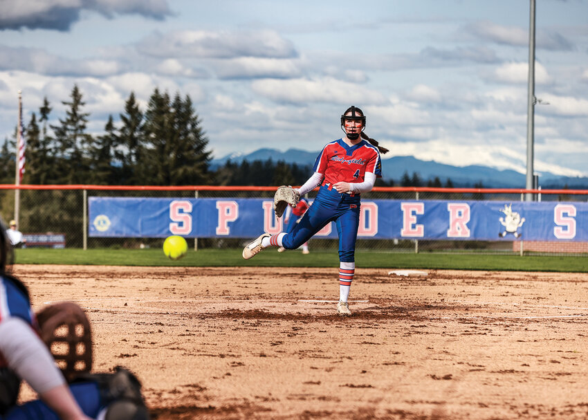 Ridgefield&rsquo;s Madeline Bruguier fires in a strike during the Spudders&rsquo; 7-2 win over Columbia River High School on Wednesday, April 9.
