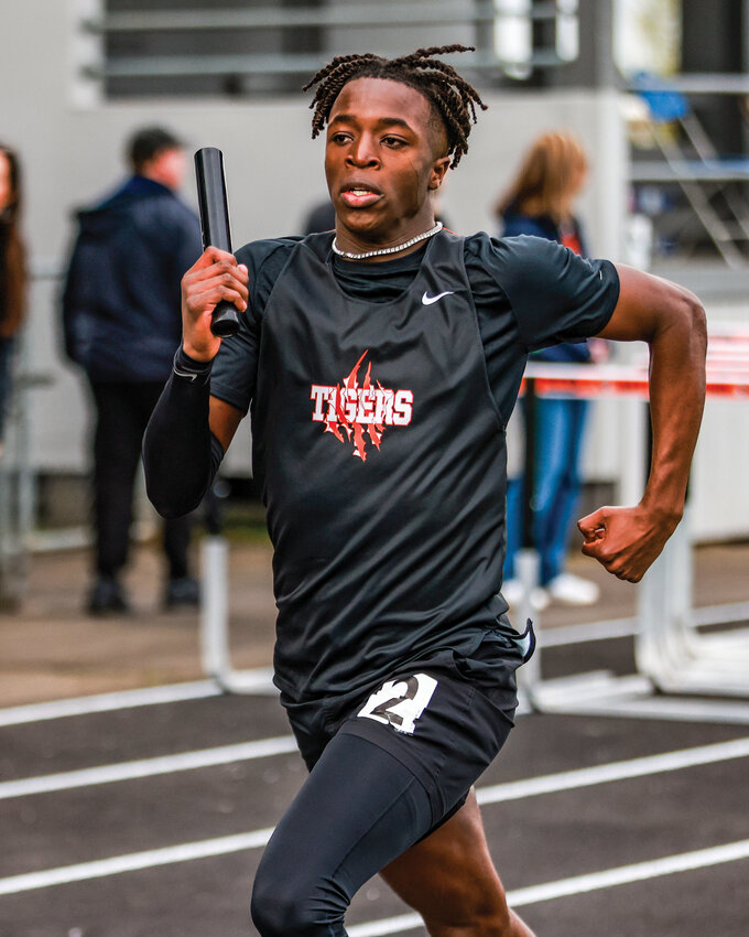 Battle Ground&rsquo;s Trent Richardson runs in the boys distance medley relay where the Battle Ground squad recorded a new personal record with a time of 10:47.11 during the Tiger Invite on Saturday, April 12.