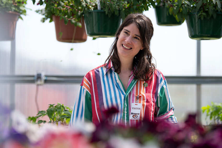 Congresswoman Marie Gluesenkamp Perez smiles while talking to students in the greenhouse at Napavine High School on Tuesday, April 22.