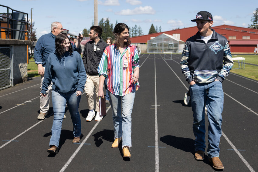 Congresswoman Marie Gluesenkamp Perez talks to Napavine seniors Tommy Deebach, right, and Kaitlyn Aschenbrenner during a tour of the CTE program at Napavine High School on Tuesday, April 22.