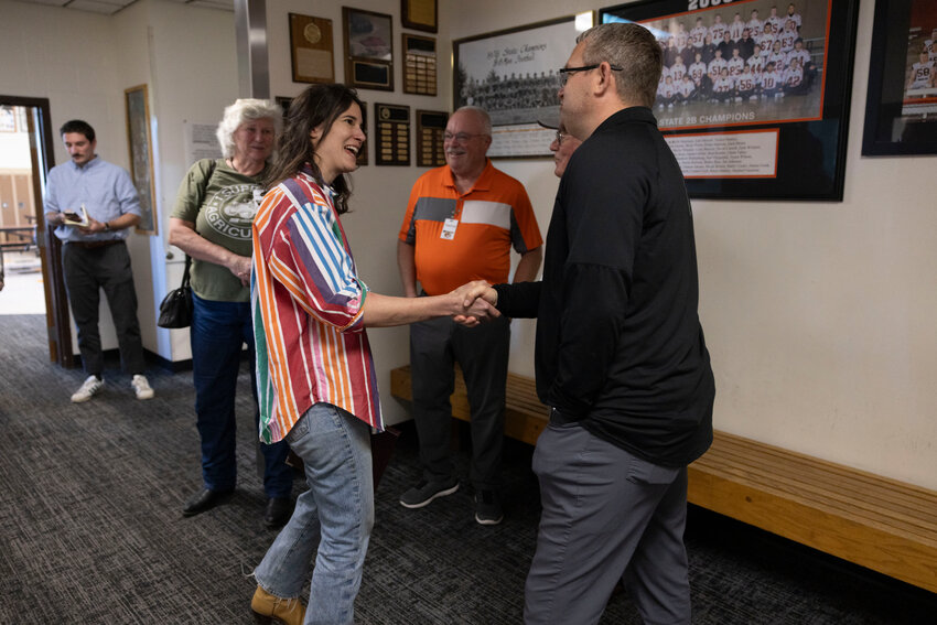Congresswoman Marie Gluesenkamp Perez shakes hands with Napavine High School Superintendent Shane Schutz in the main office on Tuesday, April 22, 2025.