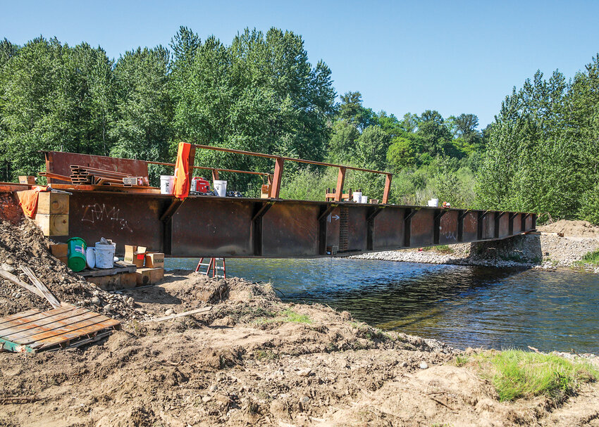 A temporary construction-access bridge was nearing completion across the East Fork Lewis River on Thursday, May 1 at the site of the Lower Columbia Estuary Partnership&rsquo;s habitat restoration project that covers three river miles downstream from Daybreak Park.