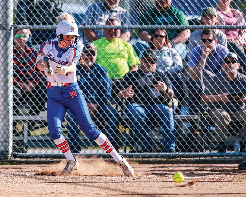 Ridgefield&rsquo;s Tava Whitlow slap hits a ball during the Spudders&rsquo; 6-1 win over the Woodland Beavers on Wednesday, April 30.
