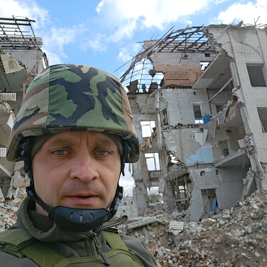 Mikhail Pavenko stands in front of a destroyed apartment complex following a Russian airstrike. Located in the Zaporizhie region, the site is one of many civilian targets that have come under intensified attacks. Pavenko says such strikes have only escalated under the Trump administration.