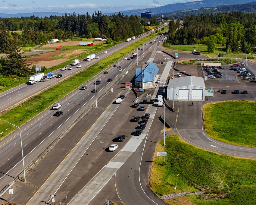 Investigators&rsquo; vehicles line the entrance to the Washington State Patrol Scale House along Interstate 5 north in Ridgefield on Thursday, May 8, after a Clark County Sheriff&rsquo;s Office deputy fatally stabbed a suspected DUI suspect after the suspect attempted to take his firearm during an altercation just before midnight on Wednesday, May 7.&nbsp;