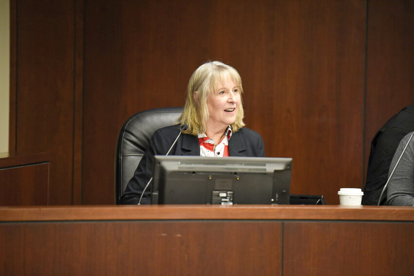 During a recent Battle Ground City Council meeting, Jeanie Kuypers sits at the dais. Appointed in 2024 to fill a vacancy left by Adrian Cortes, she now faces a challenge from former mayor Philip Johnson, who is returning from retirement.