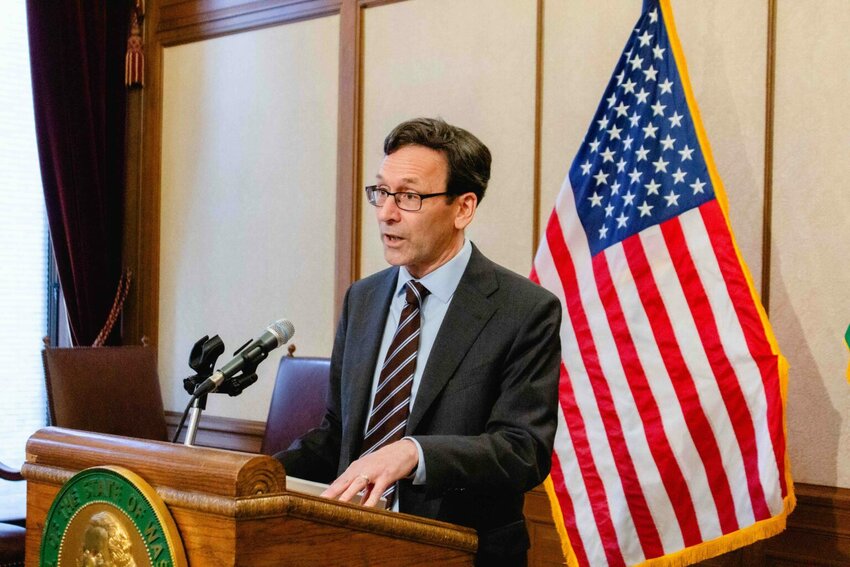Gov. Bob Ferguson speaks to reporters about the budget on Tuesday, April 1, 2025. He has until Tuesday to act on what the Legislature passed. Several tax bills also await action by the governor. (Photo by Jacquelyn Jimenez Romero/Washington State Standard)