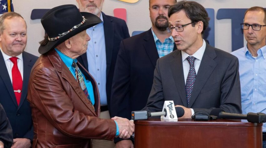 Washington Gov. Bob Ferguson signs Engrossed Second Substitute House Bill No. 1912 on May 15, 2025, in Kennewick. The bill is related to the exemption for fuels used for agricultural purposes in the climate commitment act. The legislation's primary sponsor was state Rep. Tom Dent.