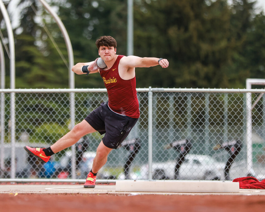 Prairie senior Will Foster launches the shot put 60 feet, 11 inches to win the 3A boys track and field district meet on Thursday, May 15, at Evergreen High School.