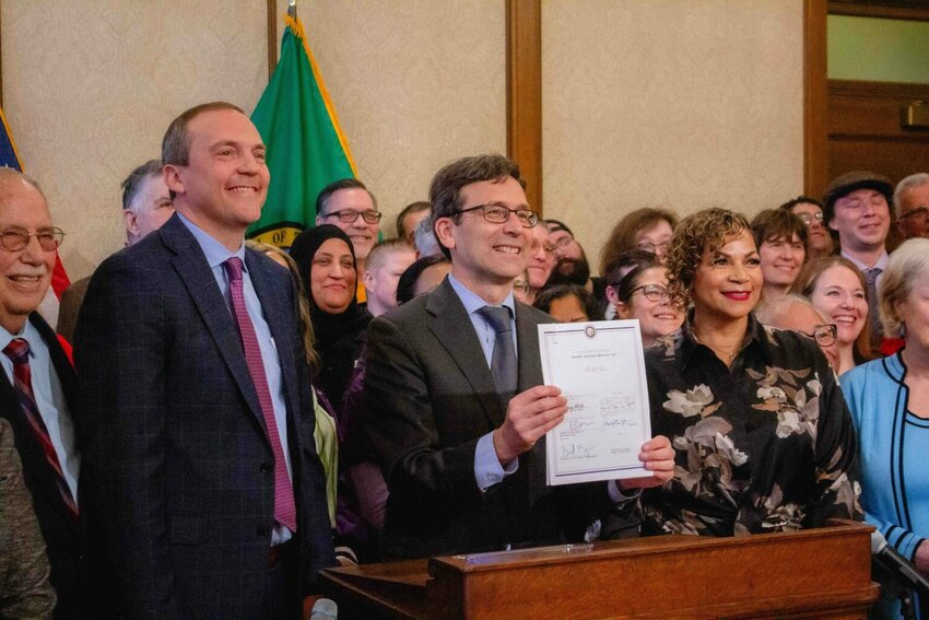 Labor advocates filled up the governor&rsquo;s conference room on Monday, May 19, 2025 and watched Gov. Bob Ferguson sign Senate Bill 5041, which extends unemployment insurance to striking workers. (Photo by Jacquelyn Jimenez Romero/Washington State Standard)