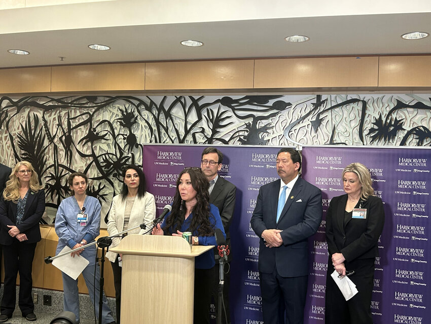 Jen Chong Jewell, the mother of a child with developmental disabilities, speaks at a press conference on proposed cuts to Medicaid alongside Washington Gov. Bob Ferguson at Harborview Medical Center in Seattle on Thursday, May 22, 2025.