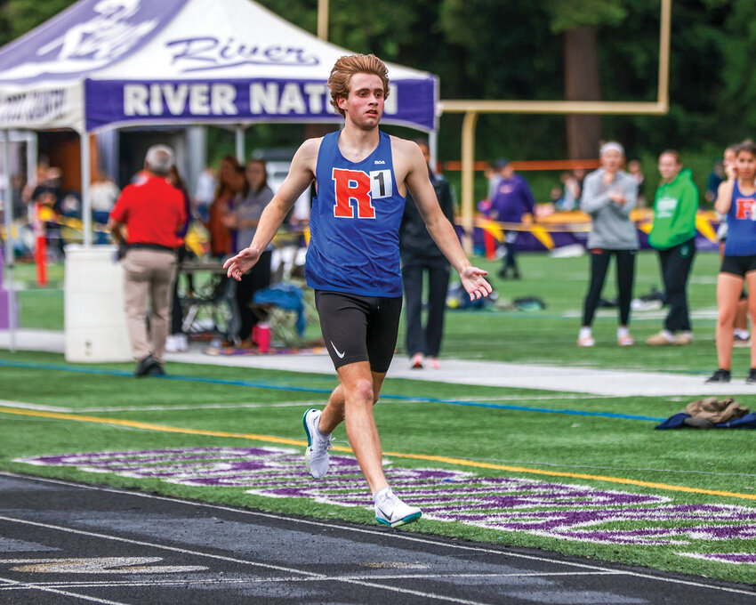 Ridgefield senior runner Davis Sullivan finishes first in the boys 1,600 meters race at the 2A District IV Track and Field Championships at Columbia River High School on Thursday, May 22.