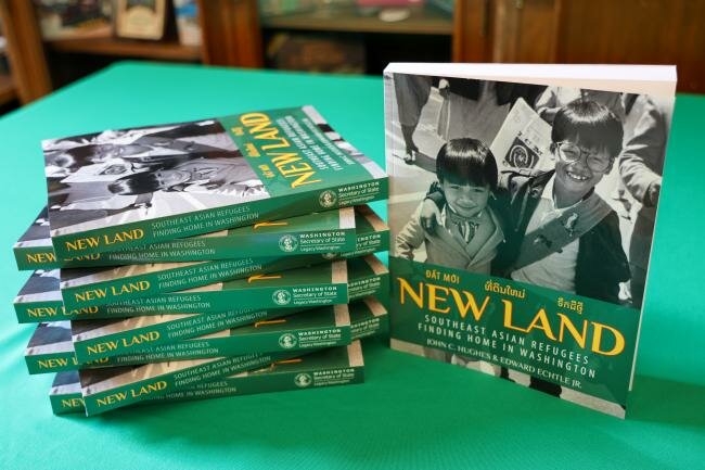 &ldquo;New Land: Southeast Asian Refugees Finding Home in Washington&rdquo; was written by John C. Hughes and Edward Echtle Jr.
